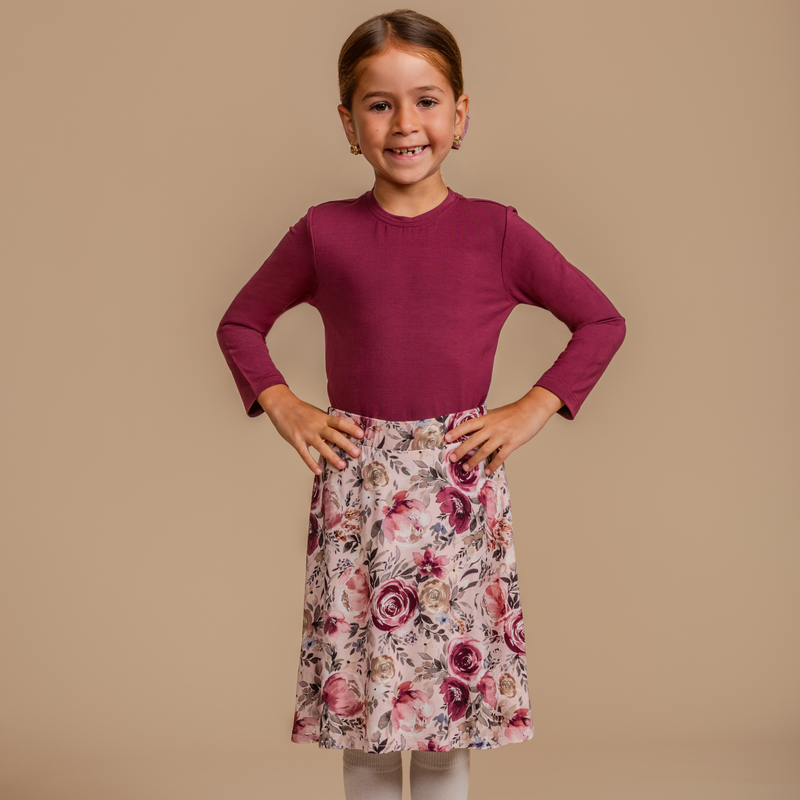 Girls' bamboo long-sleeve top with a burgundy bodice, offering modest style, soft comfort, and all-day wear.
