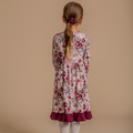 Girls' bamboo long-sleeve floral dress with a ruffle hem, offering modest style, soft comfort, and all-day wear.