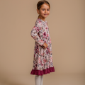 Girls' bamboo long-sleeve floral dress with a ruffle hem, offering modest style, soft comfort, and all-day wear.