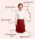 Girls' bamboo long-sleeve turtleneck top in ivory with a henna bamboo pleated skirt, offering modest style, soft comfort, and all-day wear.