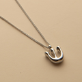 Silver Hebrew letter pendant necklace with a polished finish, offering a timeless, meaningful design for everyday wear and thoughtful gifting.