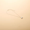 Silver letter M pendant necklace with a polished finish, offering a timeless, personalized design for everyday wear and thoughtful gifting.