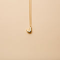 Gold letter J pendant necklace with a polished finish, offering a timeless, personalized design for everyday wear and thoughtful gifting.