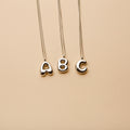 Silver letter A, B, and C pendant necklaces with a polished finish, offering timeless, personalized designs for everyday wear and thoughtful gifting.