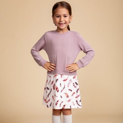 Girls' bamboo sweater dress in light gray with a feather print skirt, offering modest style, soft comfort, and all-day wear.