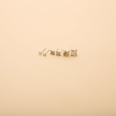Silver stud earrings set featuring polished and crystal flower designs, perfect for everyday wear and effortless style.