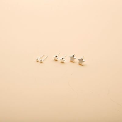 Silver star stud earrings set in three sizes, featuring a timeless, minimalist design perfect for everyday wear.