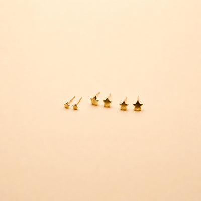 Gold star stud earrings set in three sizes, featuring a timeless, minimalist design perfect for everyday wear.