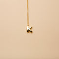 Gold letter K pendant necklace with a polished finish, offering a timeless, personalized design for everyday wear and thoughtful gifting.