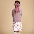 Girls' bamboo sweater dress in light gray with a feather print skirt, offering modest style, soft comfort, and all-day wear.