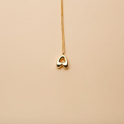 Gold letter A pendant necklace with a polished finish, offering a timeless, personalized design for everyday wear and thoughtful gifting.
