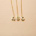 Gold letter A, B, and C pendant necklaces with a polished finish, offering timeless, personalized designs for everyday wear and thoughtful gifting.