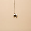 Silver letter M pendant necklace with a polished finish, offering a timeless, personalized design for everyday wear and thoughtful gifting.
