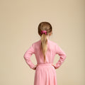 Soft satin scrunchie in pink, designed for a gentle hold, everyday comfort, and effortless style.