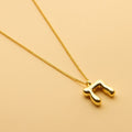 Gold Hebrew letter pendant necklace with a polished finish, offering a timeless, meaningful design for everyday wear and thoughtful gifting.