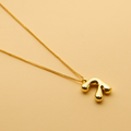 Gold Hebrew letter pendant necklace with a polished finish, offering a timeless, meaningful design for everyday wear and thoughtful gifting.