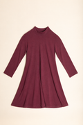 A long-sleeve mock neck dress in a deep burgundy or maroon color, laid flat against a light cream background.