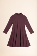 A long-sleeve, high-neck, flared dress in a deep plum purple color, laid flat against a solid cream background.
